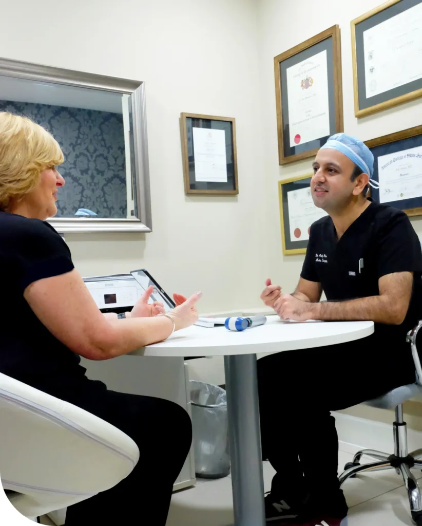 Patient consulting with Dr. Arif Aslam, skin cancer dermatologist and Mohs surgery specialist.